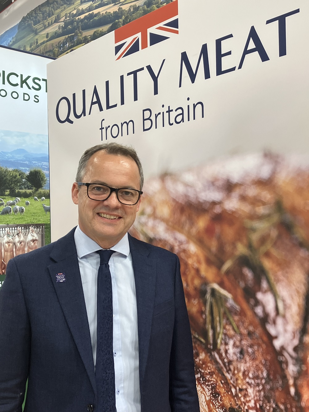 Graham Wilkinson in front of banner