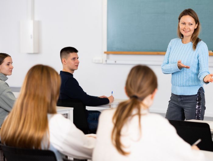 Teacher teaching students in classroom