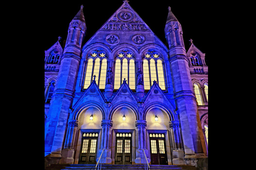 Arkwright building lit up in blue