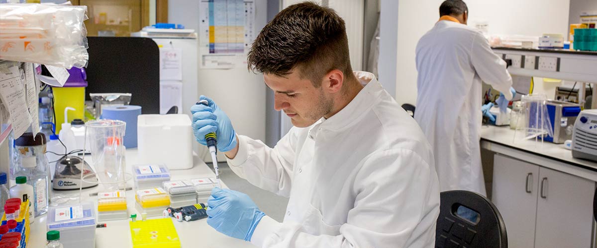 Researcher in John van Geest Cancer Research Centre lab